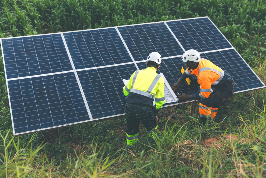 Engineer Checking solar panels in agriculture farm land. Enginee