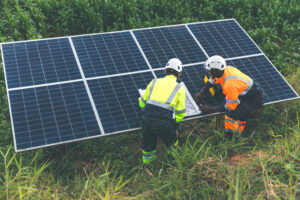 Engineer Checking solar panels in agriculture farm land. Enginee